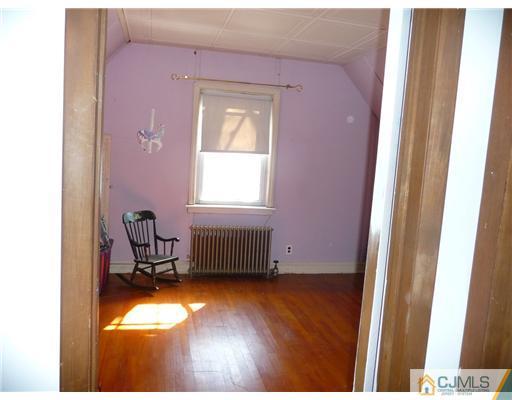 72 Old Post Road Edison, NJ 08817 - Photo 14 of 19 a view of room with window and wooden floor