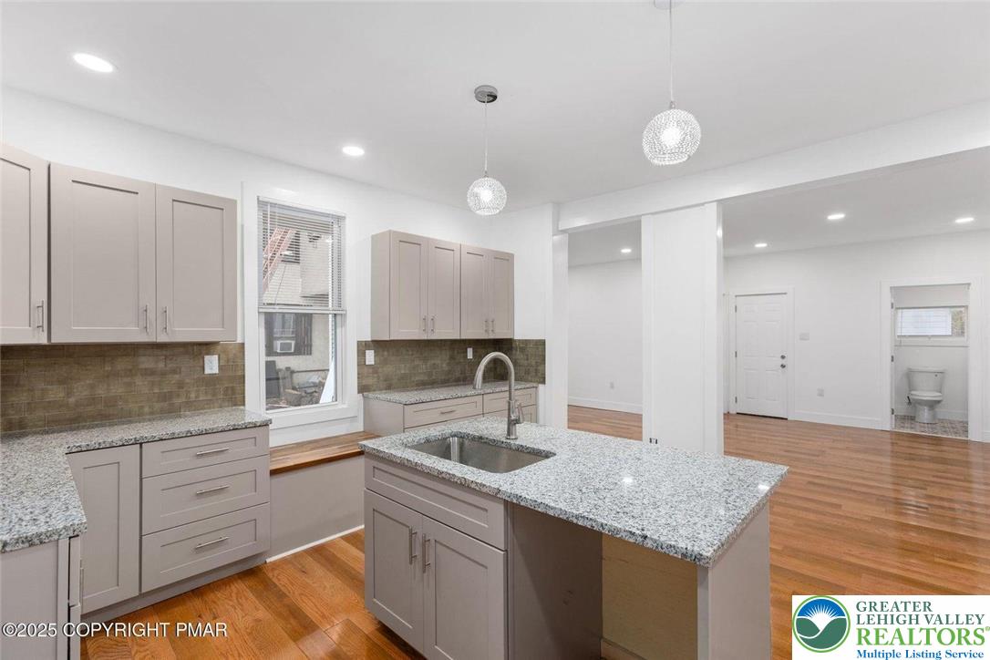 210 Fowler Street Berwick, PA 18603 - Photo 11 of 24 a kitchen with granite countertop a sink stainless steel appliances and cabinets