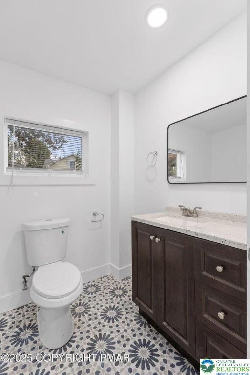 210 Fowler Street Berwick, PA 18603 - Photo 12 of 24 a bathroom with a toilet a sink and mirror