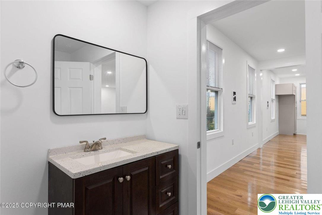 210 Fowler Street Berwick, PA 18603 - Photo 13 of 24 a bathroom with a sink vanity and a mirror