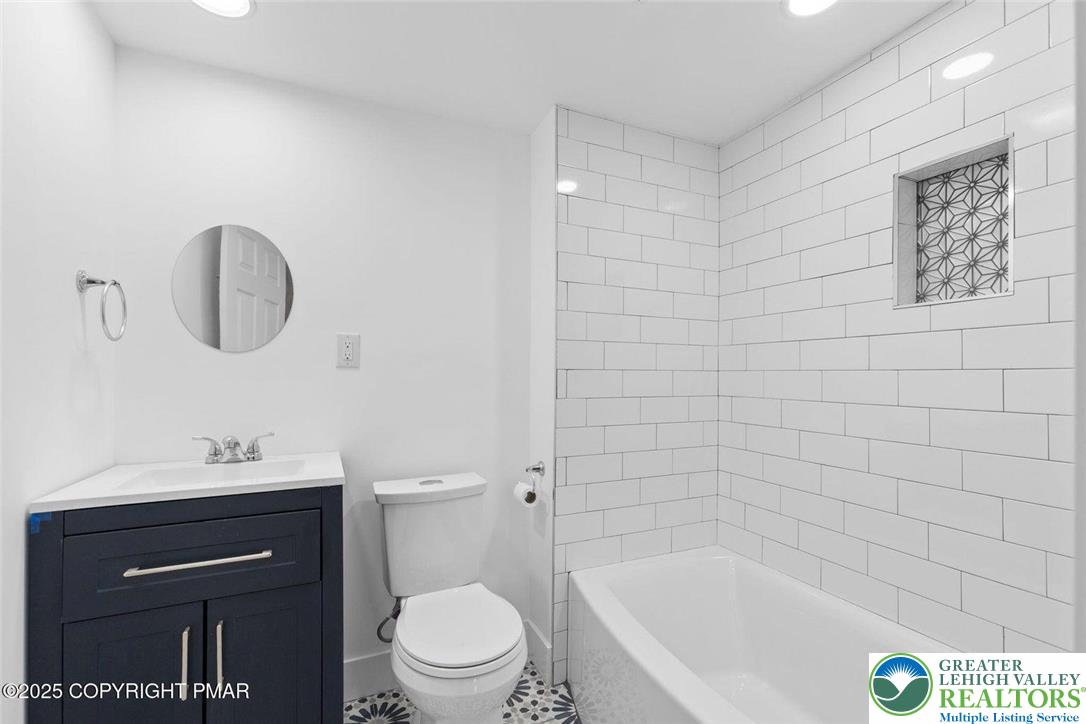 210 Fowler Street Berwick, PA 18603 - Photo 16 of 24 a bathroom with a sink a toilet and shower