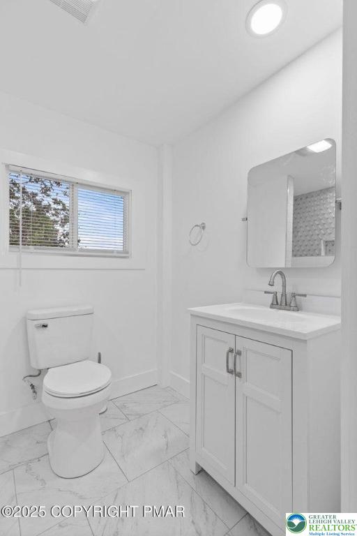 210 Fowler Street Berwick, PA 18603 - Photo 19 of 24 a bathroom with a sink a toilet and a mirror