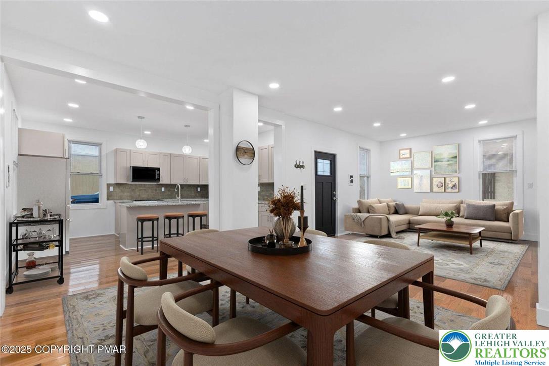 210 Fowler Street Berwick, PA 18603 - Photo 3 of 24 a room with stainless steel appliances kitchen island granite countertop a dining table chairs and view living room