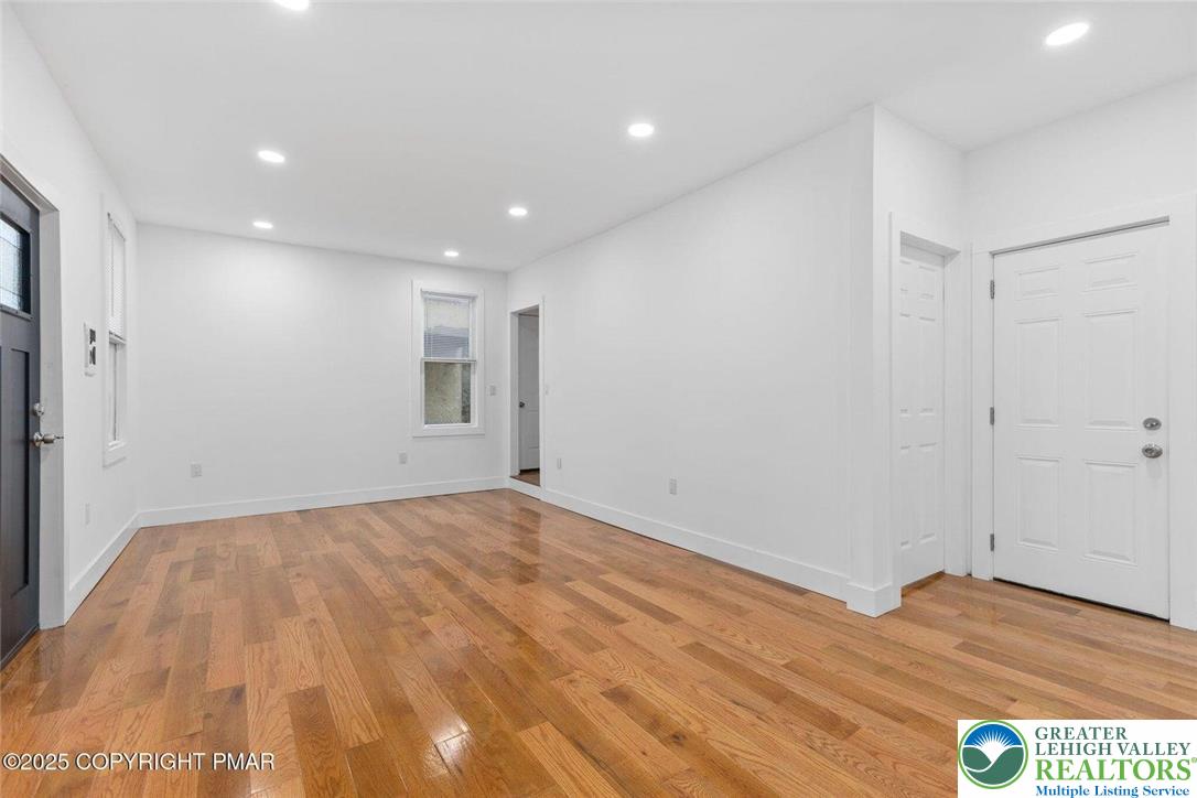 210 Fowler Street Berwick, PA 18603 - Photo 4 of 24 a view of empty room with wooden floor and fan