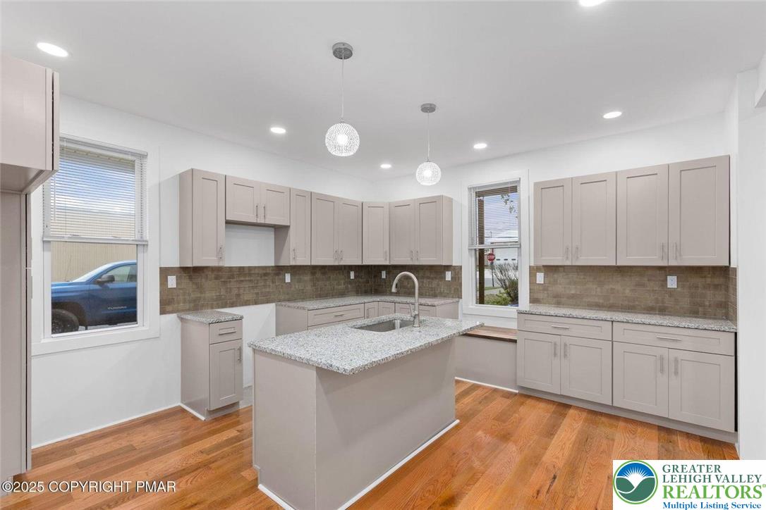 210 Fowler Street Berwick, PA 18603 - Photo 8 of 24 a kitchen with a sink window and cabinets