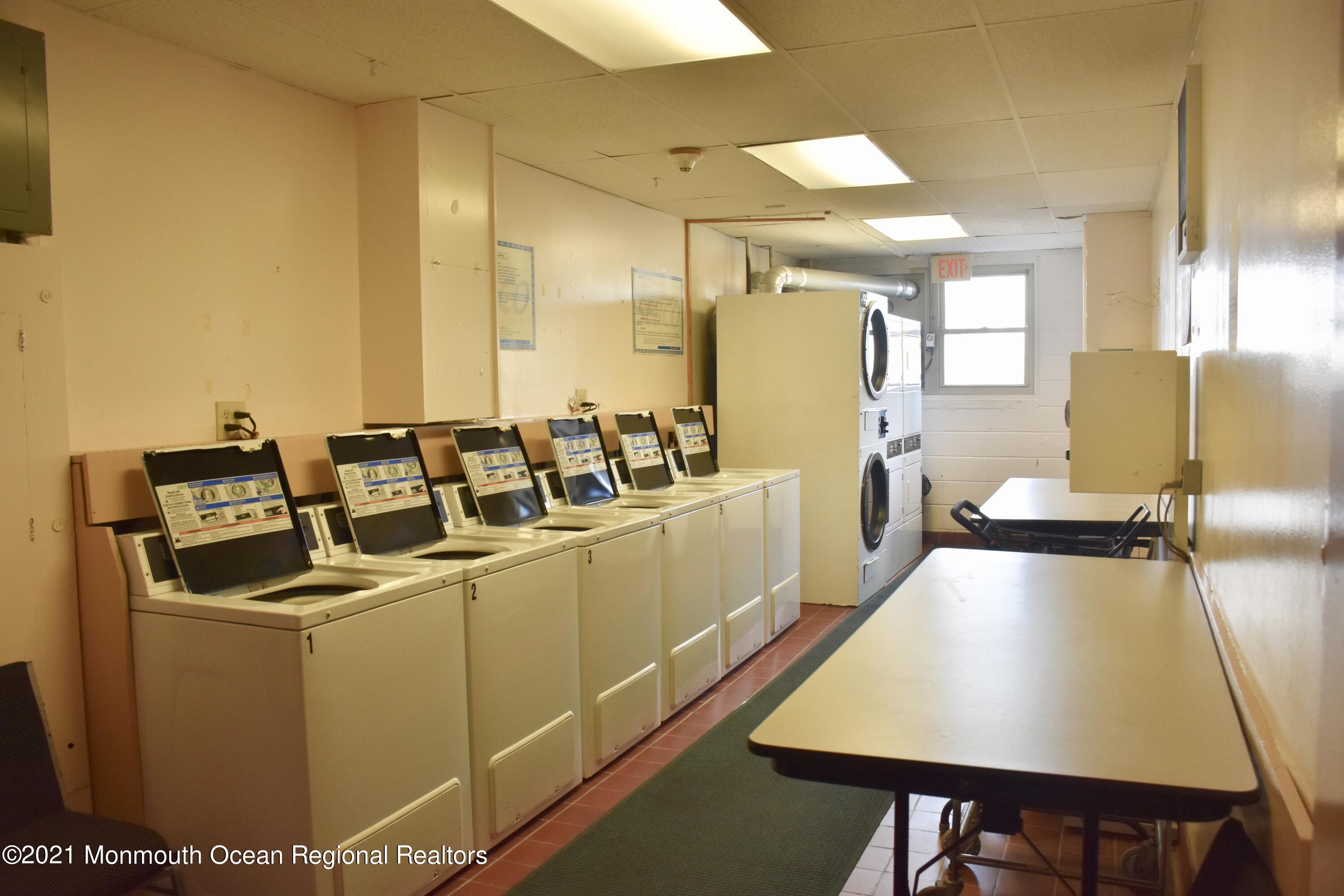 1000 River Road, Unit 3J Belmar, NJ 07719 - Photo 12 of 19 a room with sink washer and dryer
