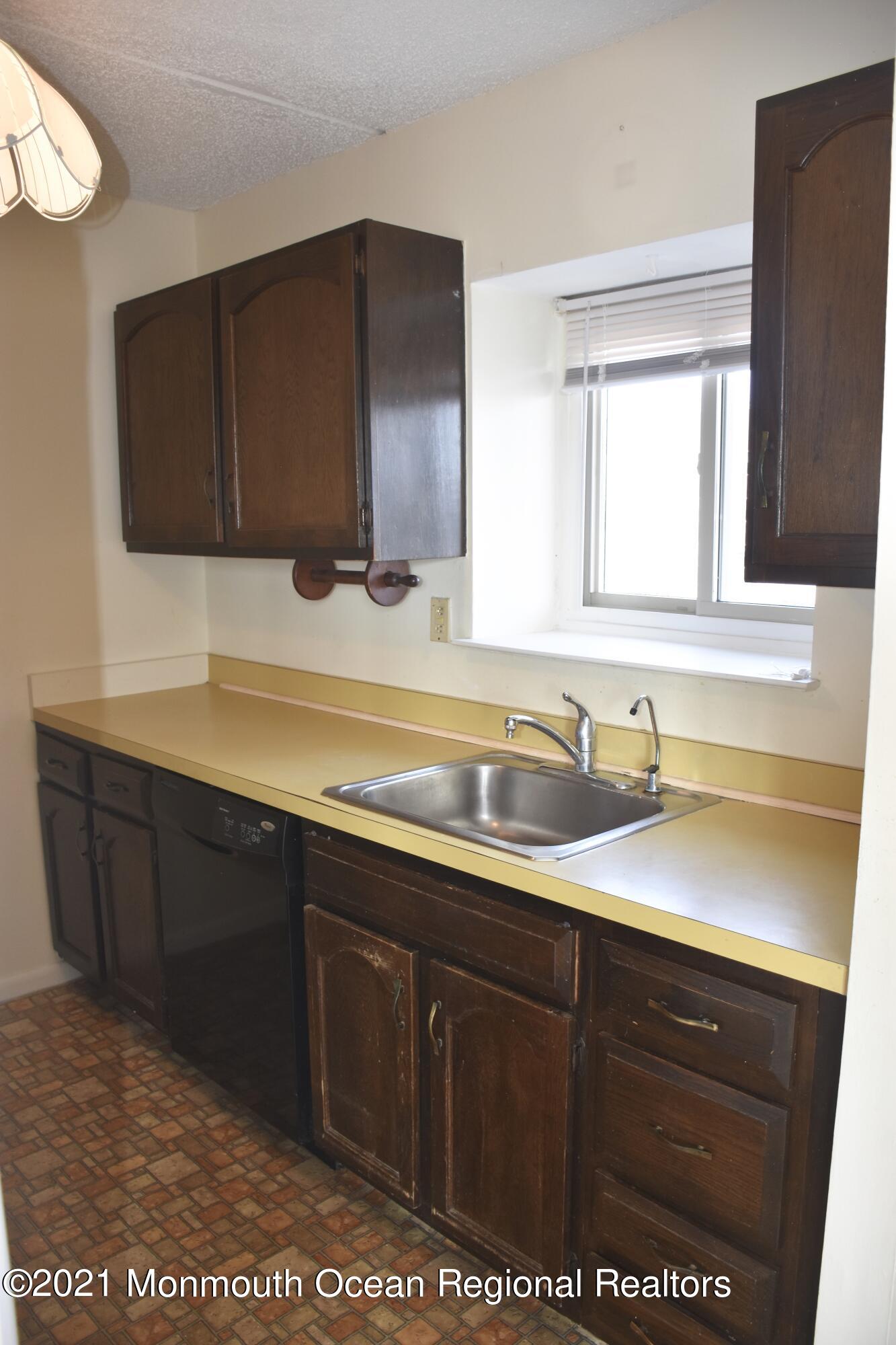 1000 River Road, Unit 3J Belmar, NJ 07719 - Photo 3 of 19 a bathroom with a sink vanity and granite