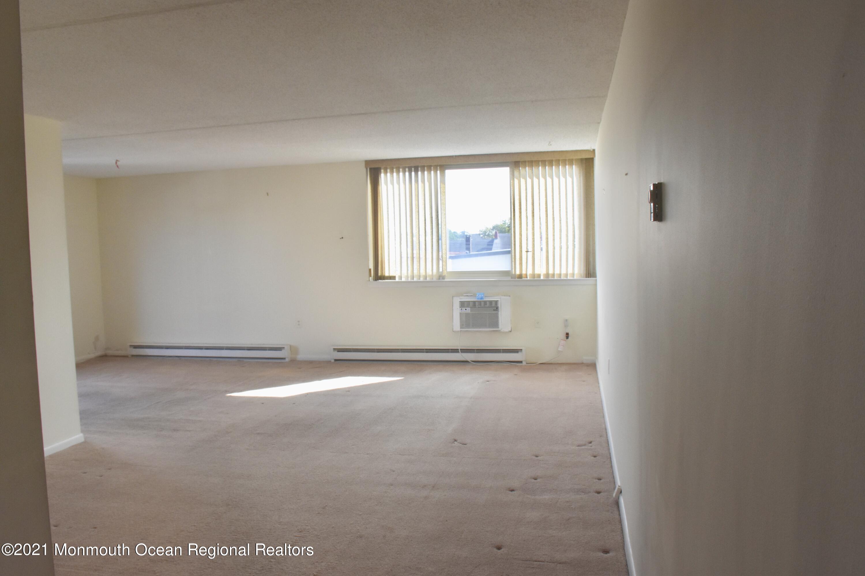1000 River Road, Unit 3J Belmar, NJ 07719 - Photo 5 of 19 an empty room with a window