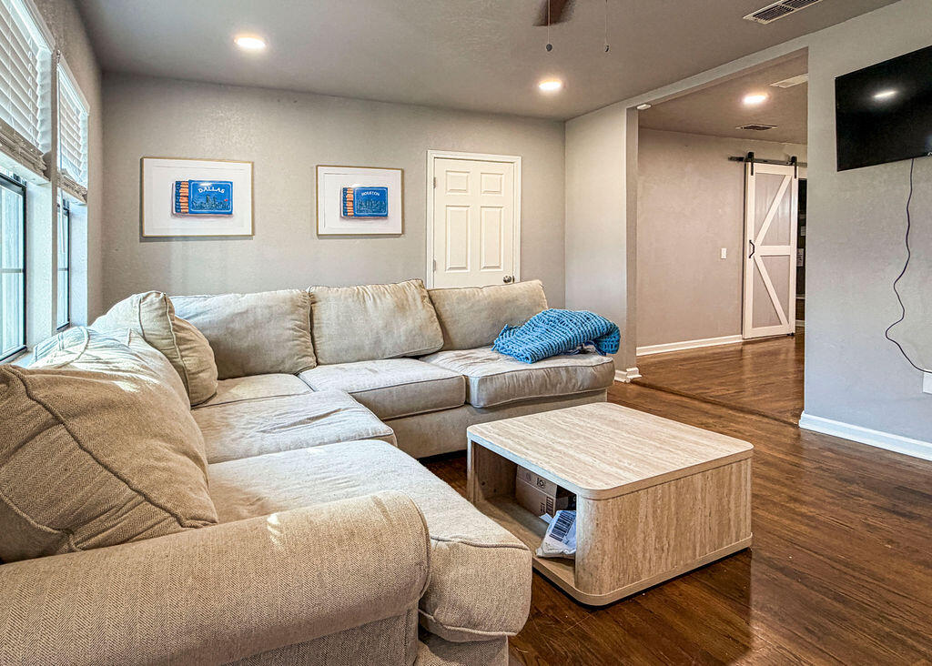 1908 47th Street Lubbock, TX 79412 - Photo 3 of 21 a living room with furniture and wooden floor