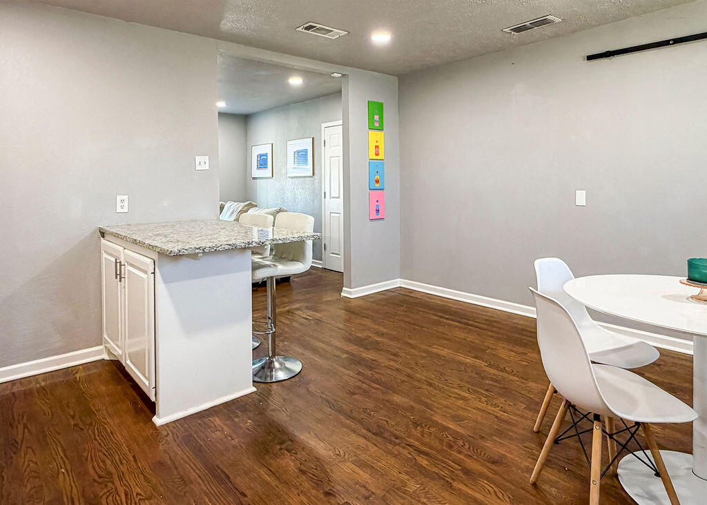 1908 47th Street Lubbock, TX 79412 - Photo 7 of 21 a workspace with furniture and wooden floor