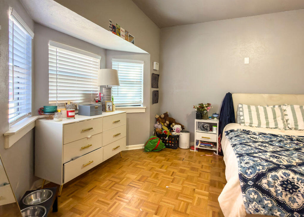 1908 47th Street Lubbock, TX 79412 - Photo 8 of 21 a bed room with a bed and a window