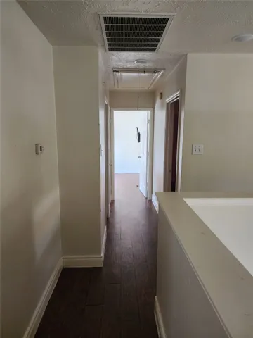 a hallway with a wooden floor