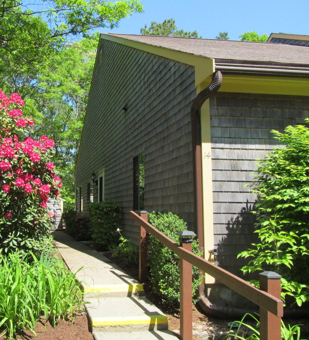 14 Round House Road Bourne, MA 02532 - Photo 1 of 18 a view of a house with a flower garden