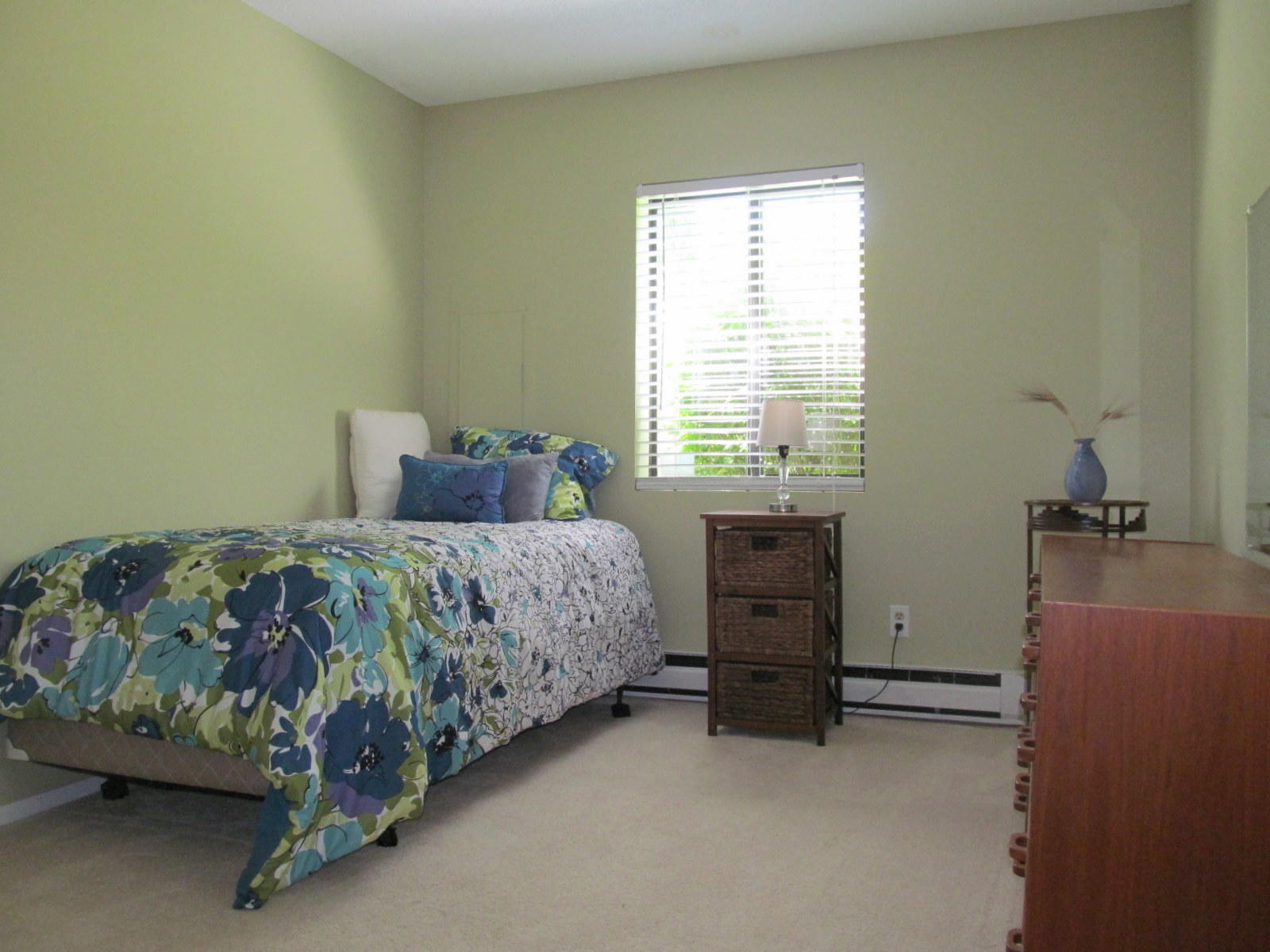 14 Round House Road Bourne, MA 02532 - Photo 10 of 18 a bedroom with a bed and a dresser next to a window