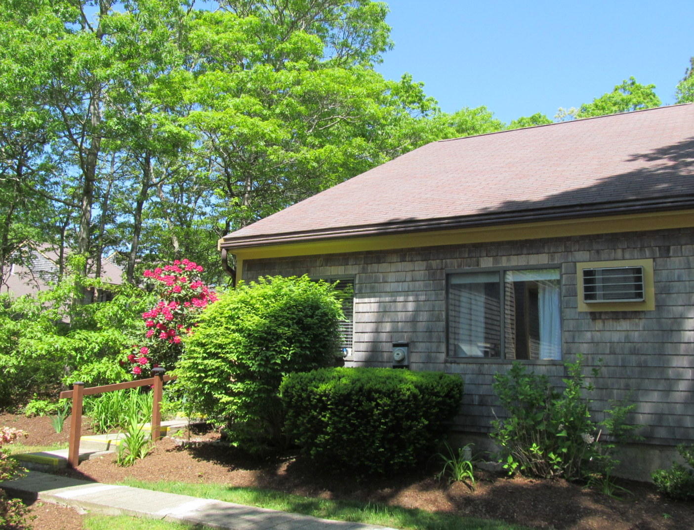 14 Round House Road Bourne, MA 02532 - Photo 17 of 18 a backyard of a house with lots of green space