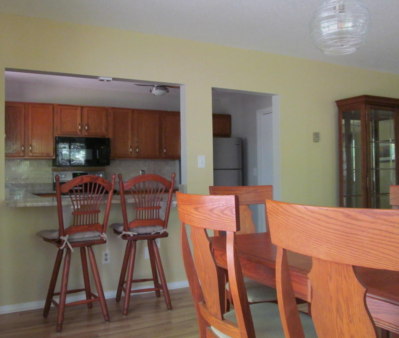 14 Round House Road Bourne, MA 02532 - Photo 4 of 18 a view of a dining room with furniture and wooden floor