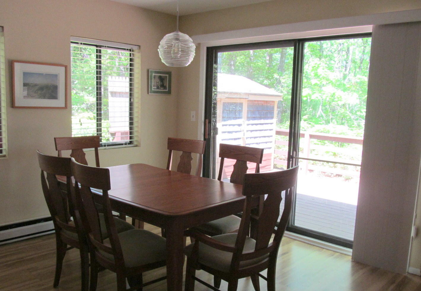 14 Round House Road Bourne, MA 02532 - Photo 8 of 18 a view of a dining room with furniture a chandelier and wooden floor