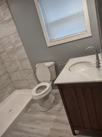 a bathroom with a toilet a sink and bathtub