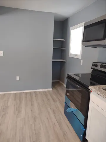 a view of an empty room and window