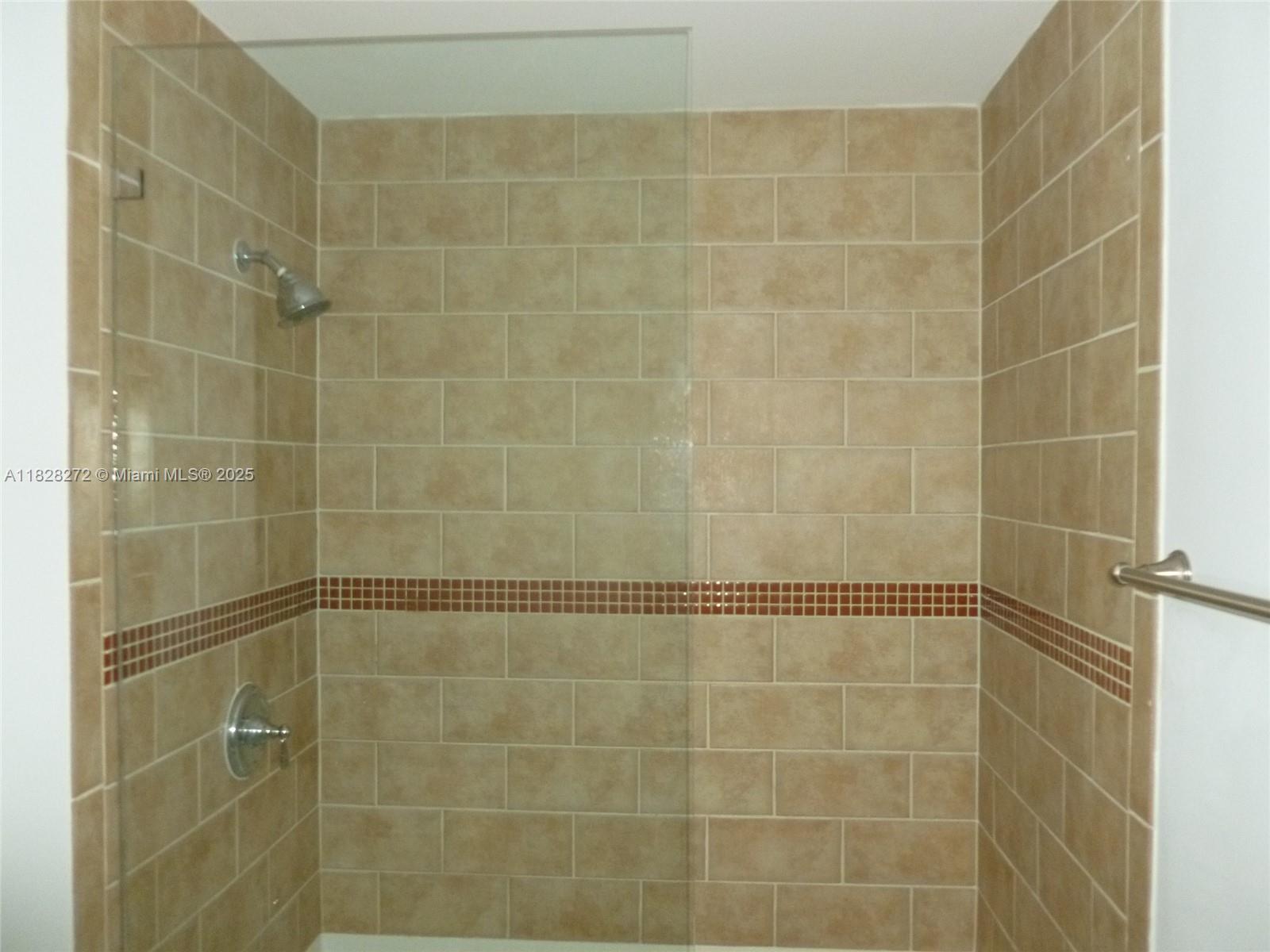 7350 Southwest 89th Street, Unit 808S Miami, FL 33156 - Photo 10 of 13 a bathroom with a shower