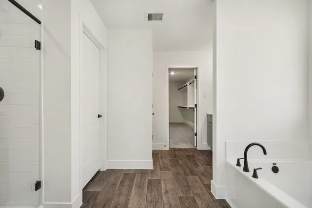 a bathroom with a sink and shower