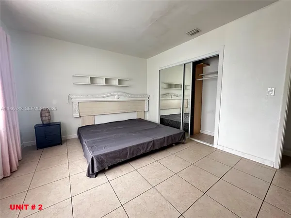 a living room with a couch and a stove top oven