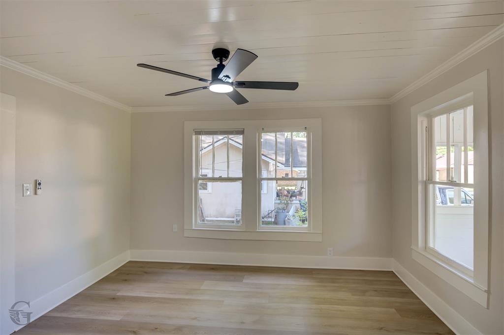 510 Constable Street Minden, LA 71055 - Photo 2 of 18 a view of an empty room with a window and wooden floor