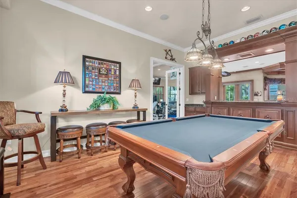 a living room with furniture a rug and a chandelier