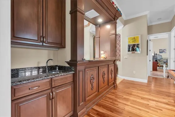 a workspace with furniture and view of kitchen