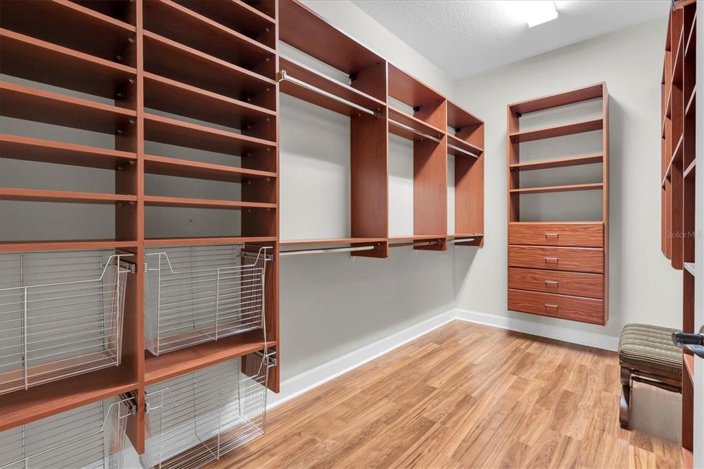 2861 Roehampton Close Tarpon Springs, FL 34688 - Photo 47 of 84 a view of walk in closet with empty racks