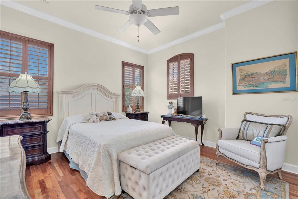 2861 Roehampton Close Tarpon Springs, FL 34688 - Photo 48 of 79 a bedroom with a bed and a couch