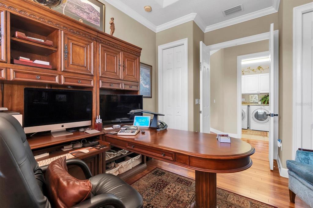 2861 Roehampton Close Tarpon Springs, FL 34688 - Photo 51 of 84 a workspace with furniture and view of kitchen