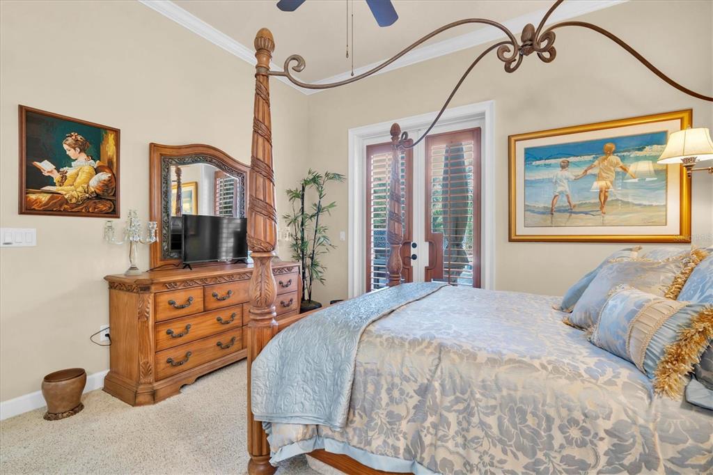 2861 Roehampton Close Tarpon Springs, FL 34688 - Photo 61 of 84 a bedroom with a bed and a flat screen tv