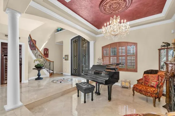 a dining room with furniture and window