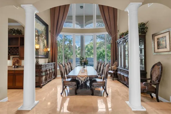 a living room with furniture a fireplace and a large window