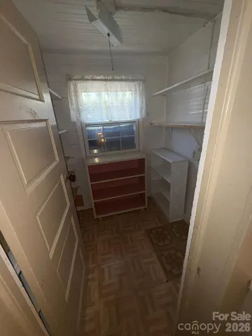 a view of storage and utility room with empty racks