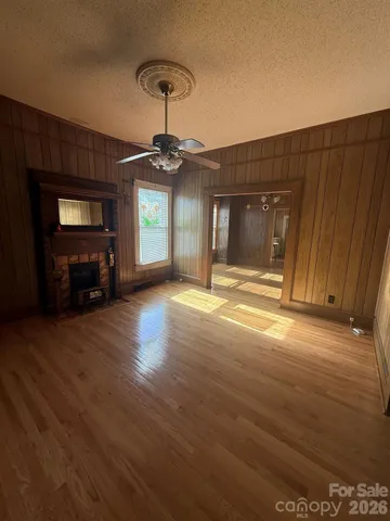 a view of a livingroom with a furniture wooden floor and window