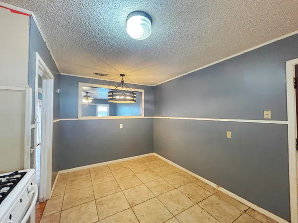 a view of a kitchen with natural light