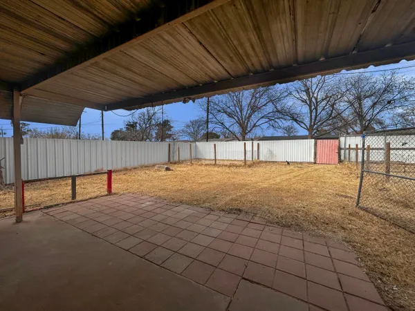 a view of a backyard of the house