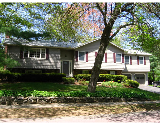 20 Sherwood Road Reading, MA 01867 - Photo 1 of 18 a front view of a house with a garden