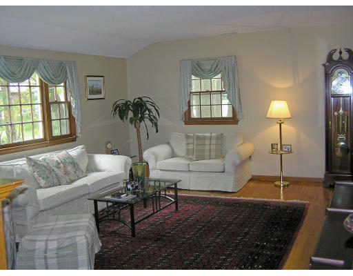 20 Sherwood Road Reading, MA 01867 - Photo 5 of 18 a living room with furniture and a large window