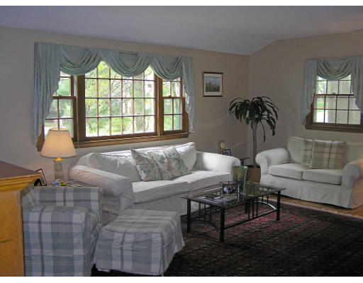 20 Sherwood Road Reading, MA 01867 - Photo 6 of 18 a living room with furniture and a large window