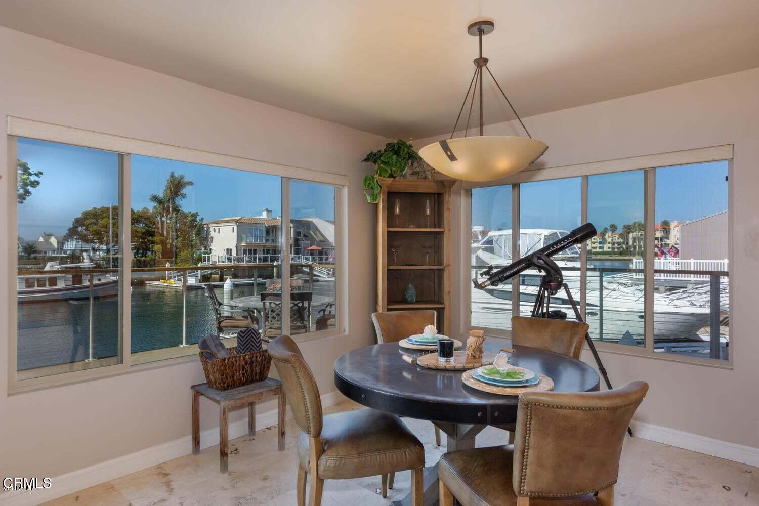 4435 Costa De Oro Oxnard, CA 93035 - Photo 12 of 50 a dining room with furniture and window