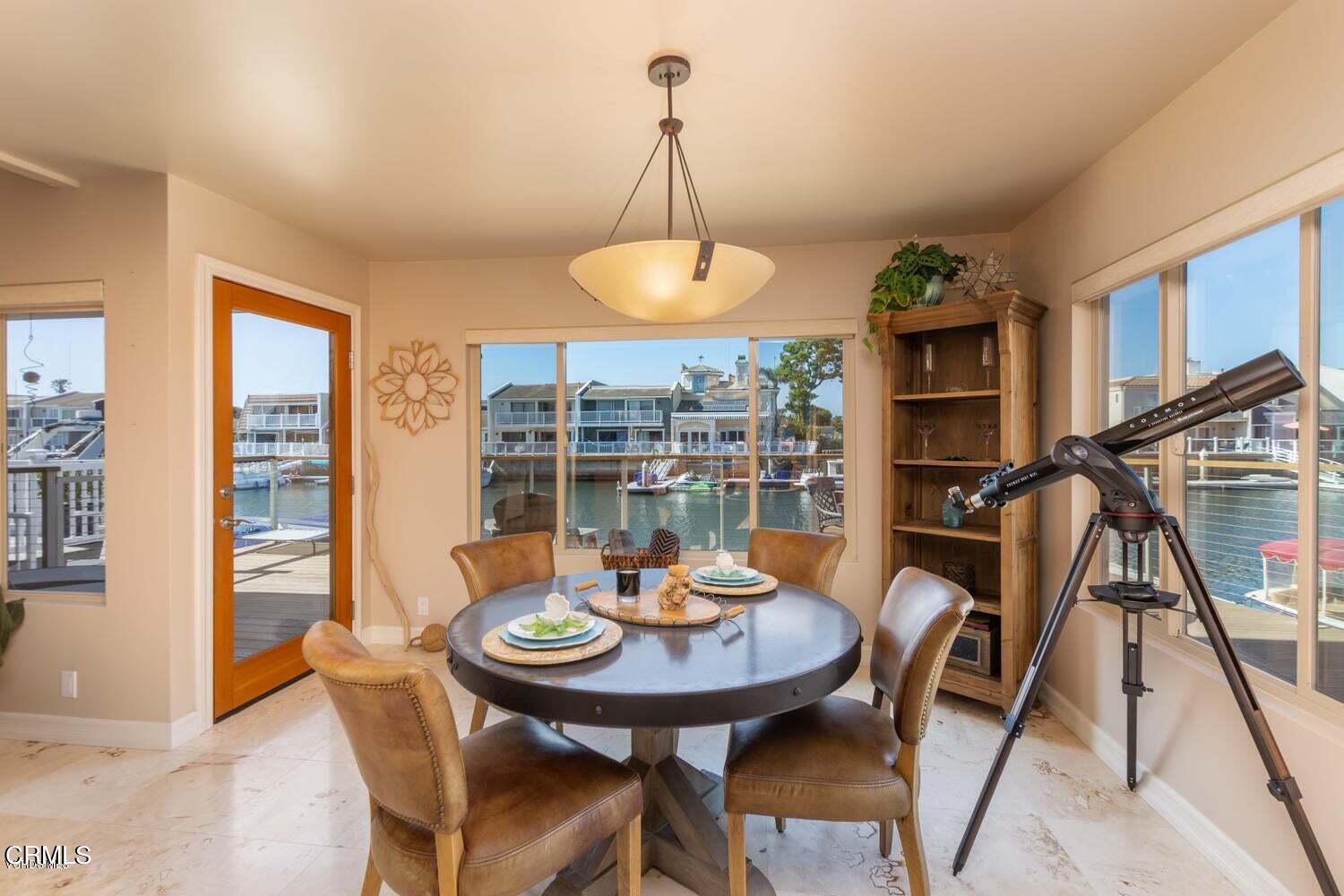 4435 Costa De Oro Oxnard, CA 93035 - Photo 13 of 50 a view of a dining room with furniture window and wooden floor