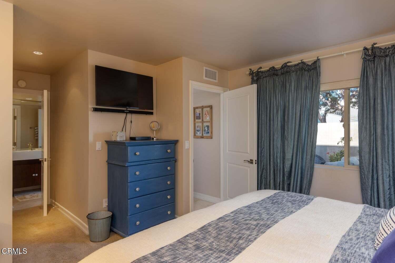 4435 Costa De Oro Oxnard, CA 93035 - Photo 18 of 50 a bedroom with a bed and a flat screen tv