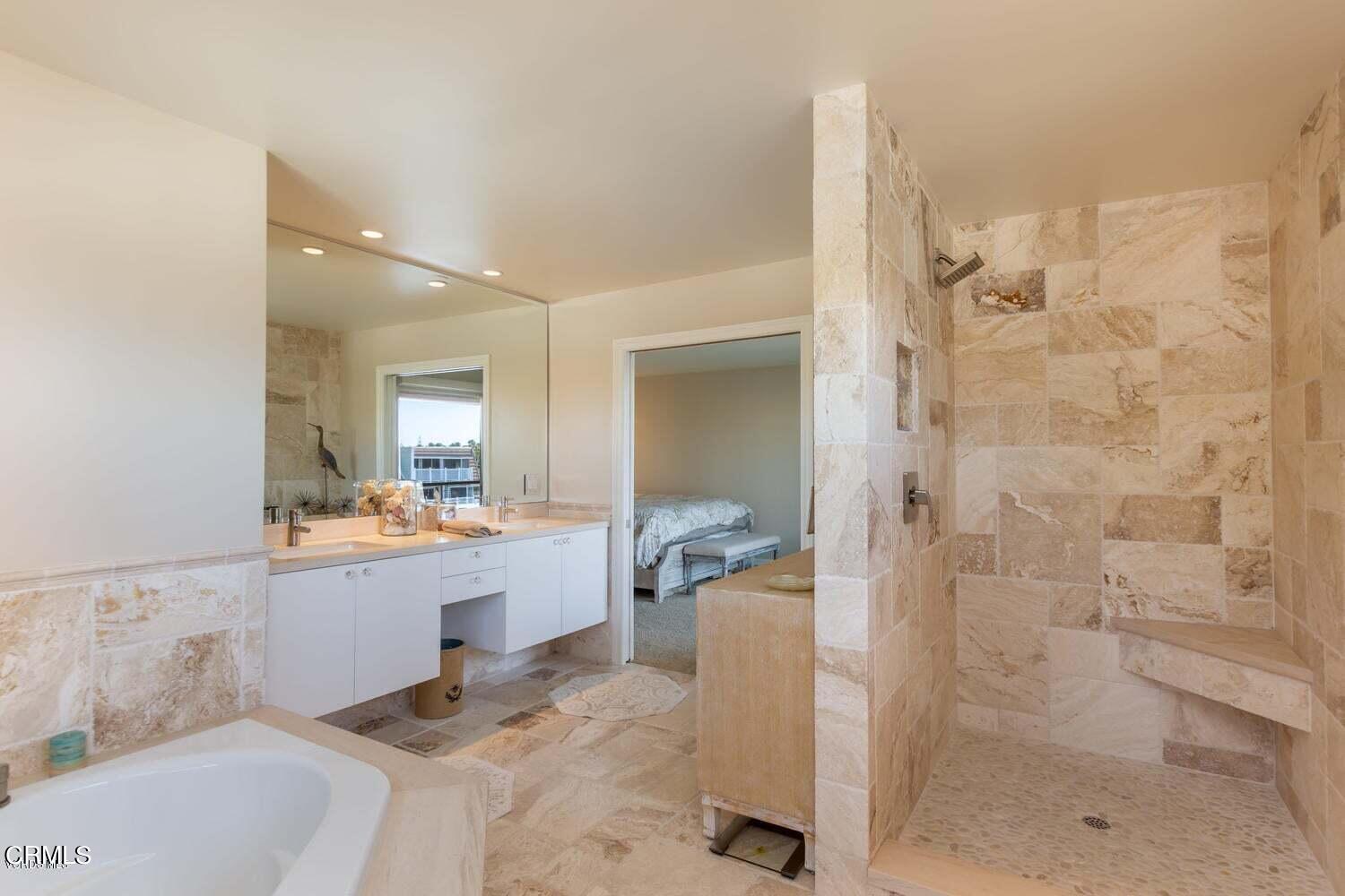 4435 Costa De Oro Oxnard, CA 93035 - Photo 23 of 50 a bathroom with a bathtub sink and mirror