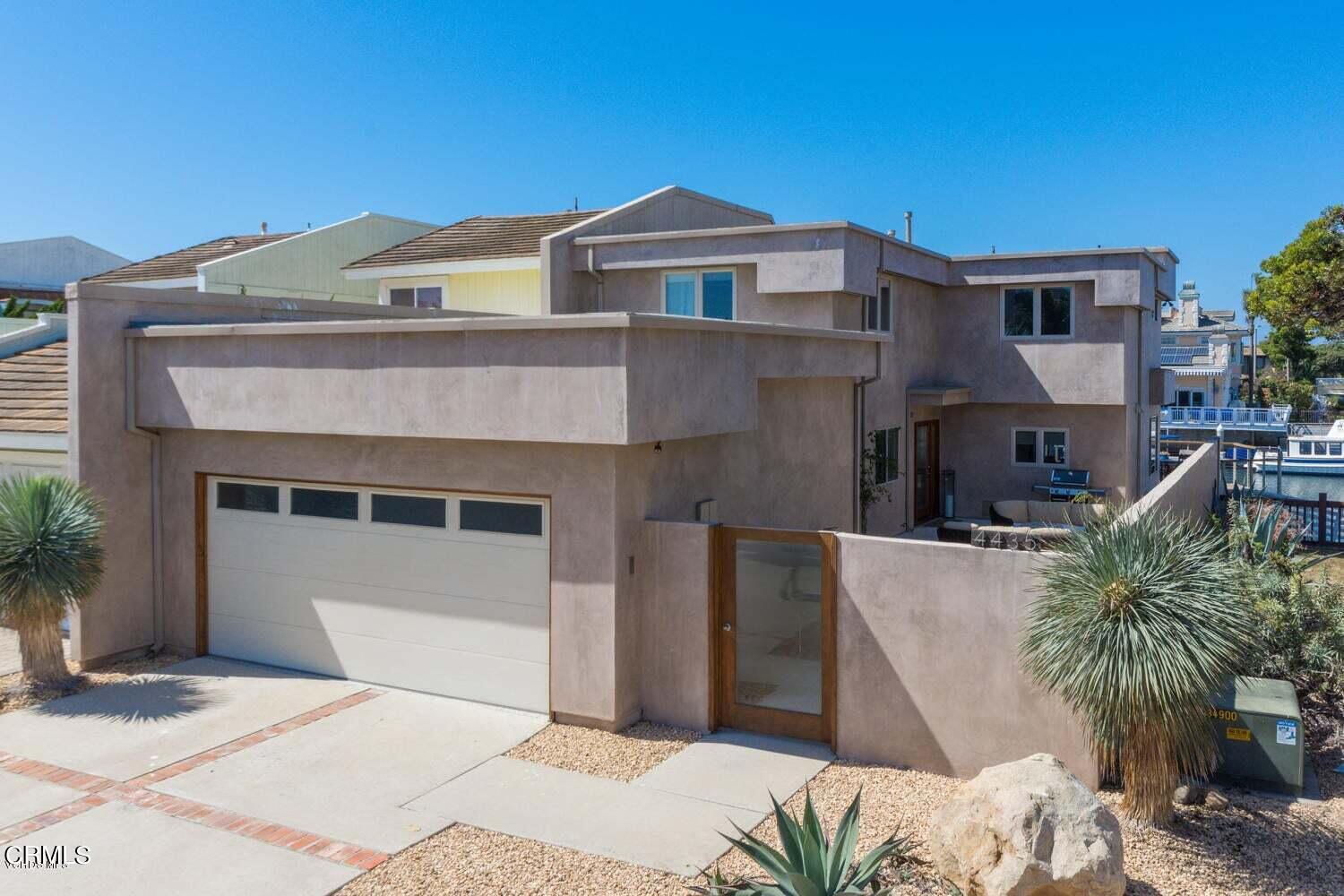4435 Costa De Oro Oxnard, CA 93035 - Photo 3 of 50 a front view of a house with a yard