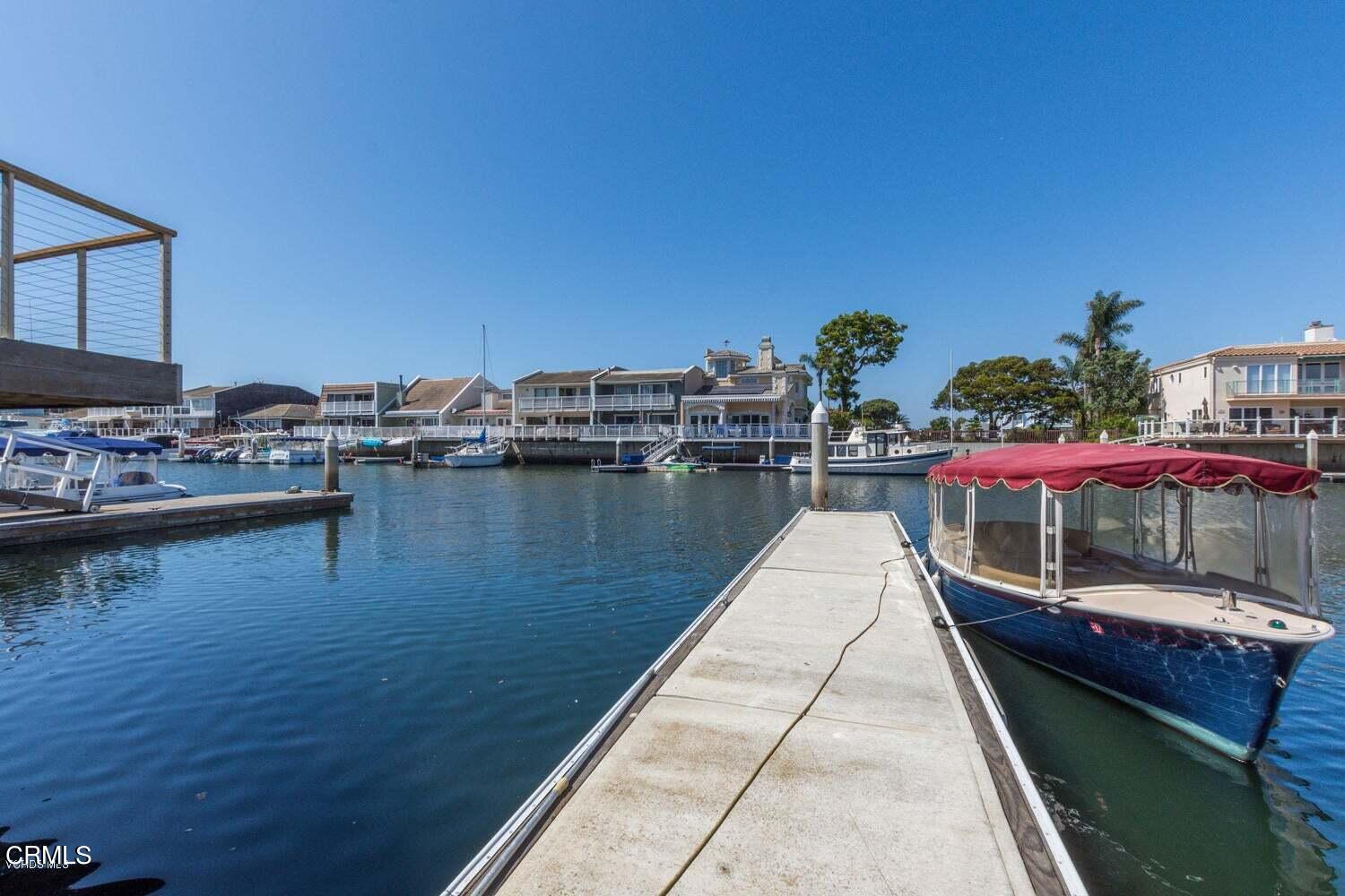 4435 Costa De Oro Oxnard, CA 93035 - Photo 32 of 50 a view of a lake with couches and lounge chairs