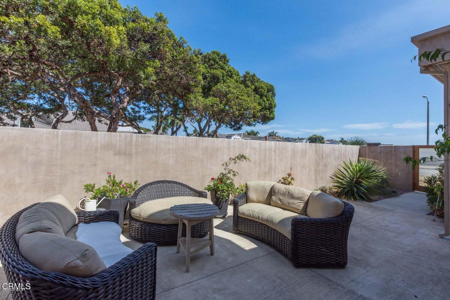 4435 Costa De Oro Oxnard, CA 93035 - Photo 5 of 50 a balcony with a table and chairs