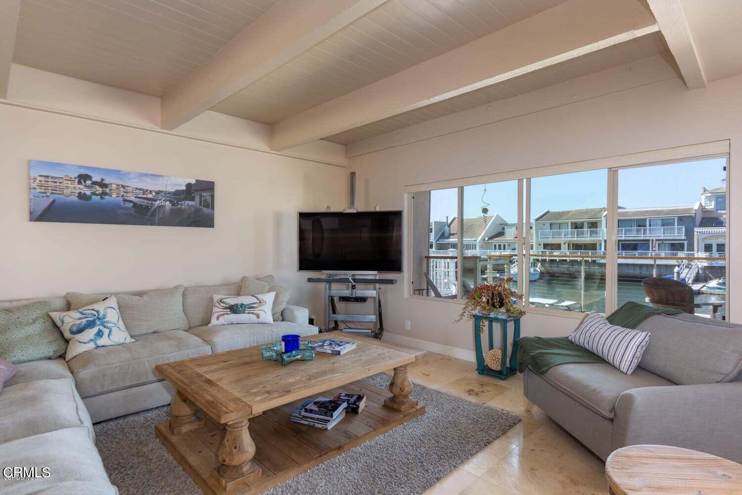 4435 Costa De Oro Oxnard, CA 93035 - Photo 6 of 50 a living room with furniture and a flat screen tv